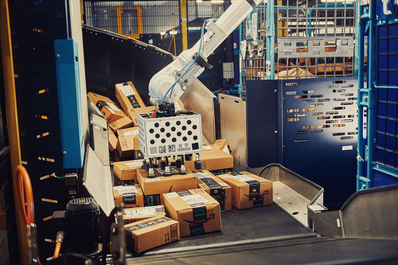 Amazon warehouse interior with robots and workers